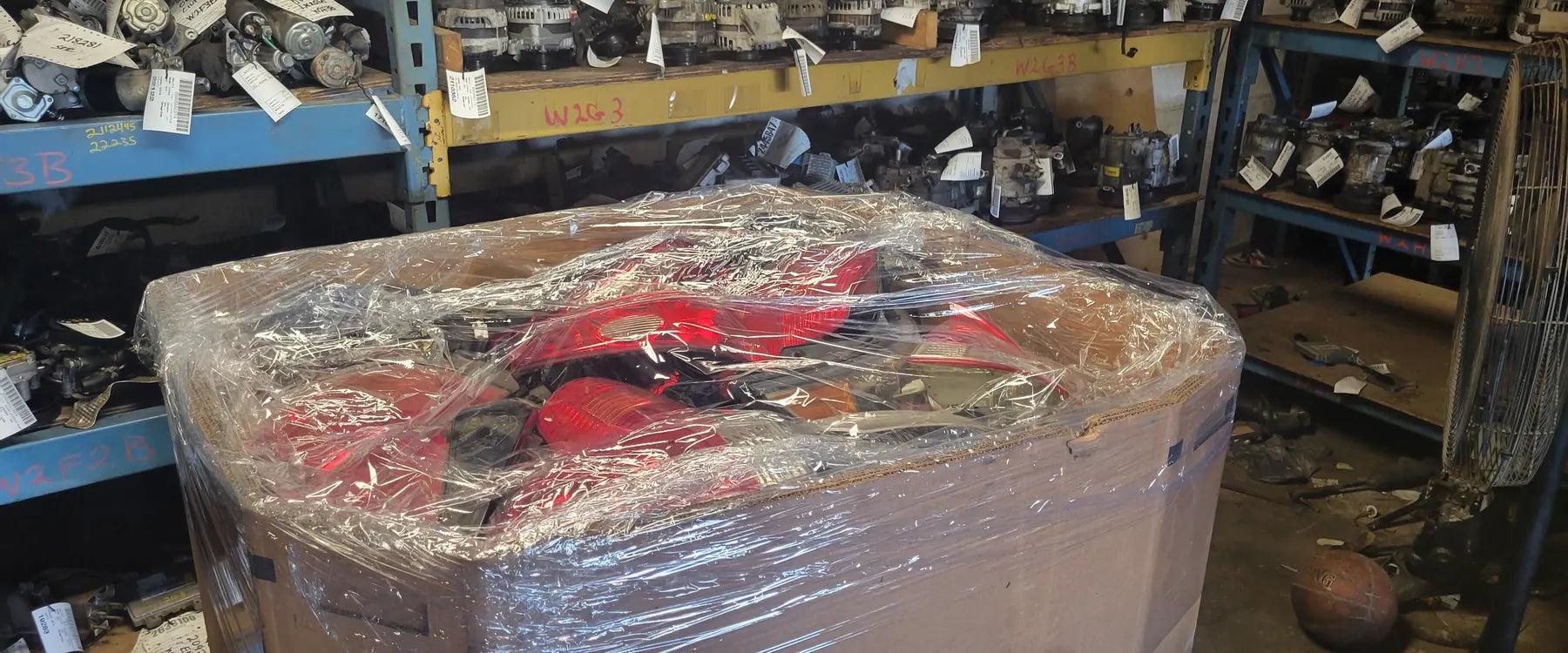A pallet of used parts wrapped for export